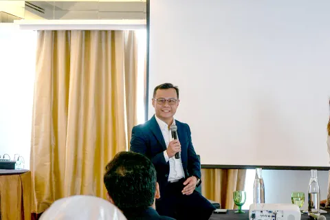 Terence Kok speaking on stage